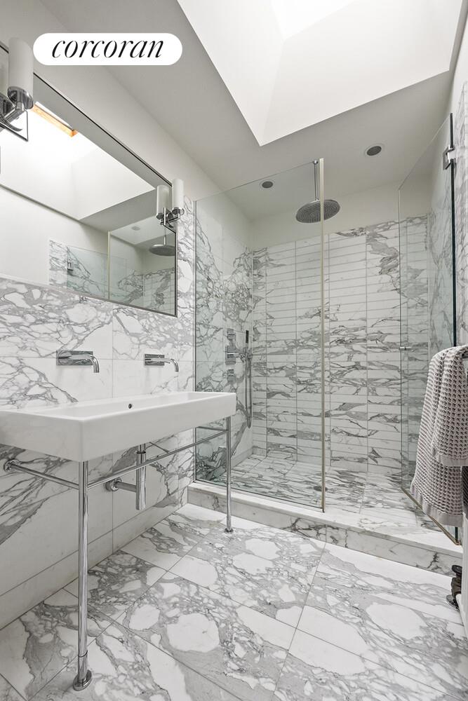 369 6th Street Brooklyn, NY 11215 - Photo 11 of 22 a bathroom with a sink and a mirror