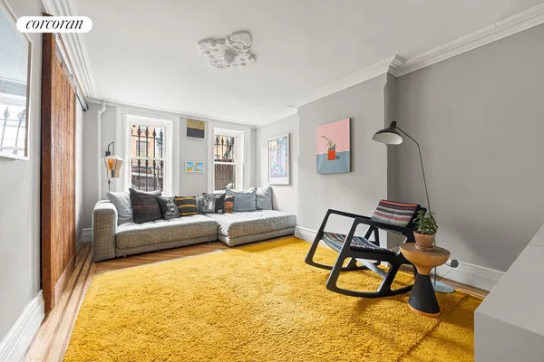 a living room with furniture and a rug