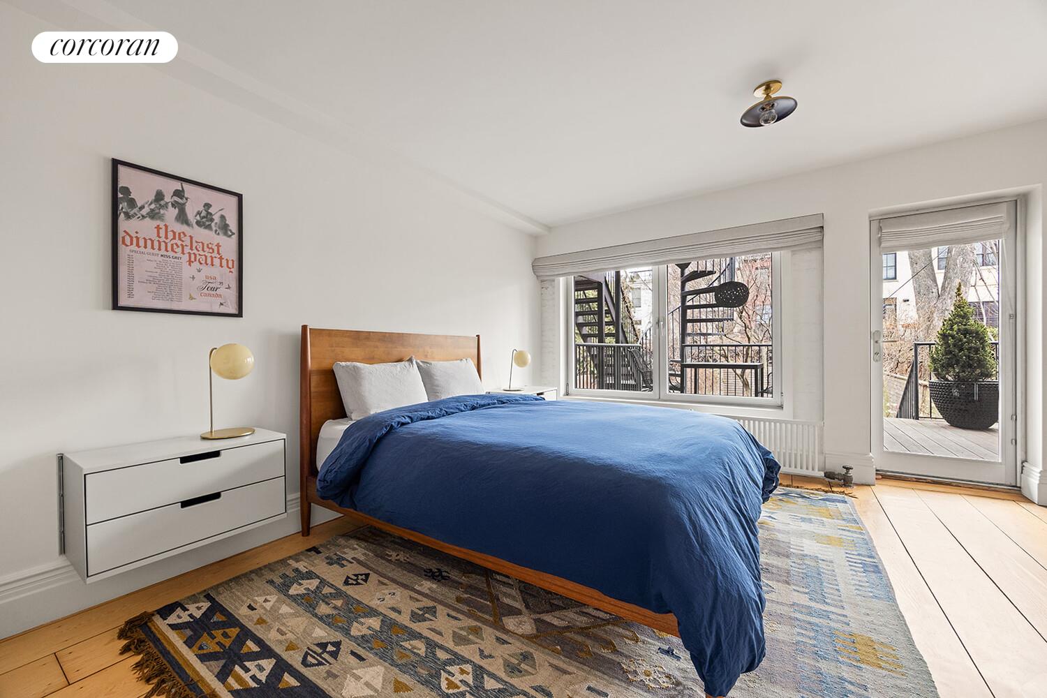 369 6th Street Brooklyn, NY 11215 - Photo 14 of 22 a bedroom with a bed and a window
