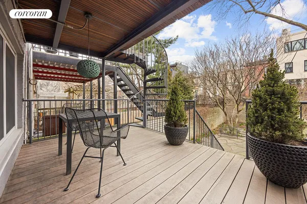 a view of outdoor space with table and chairs