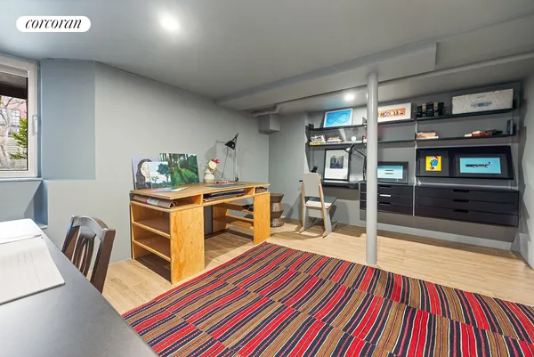 a room with furniture a piano and a bookshelf