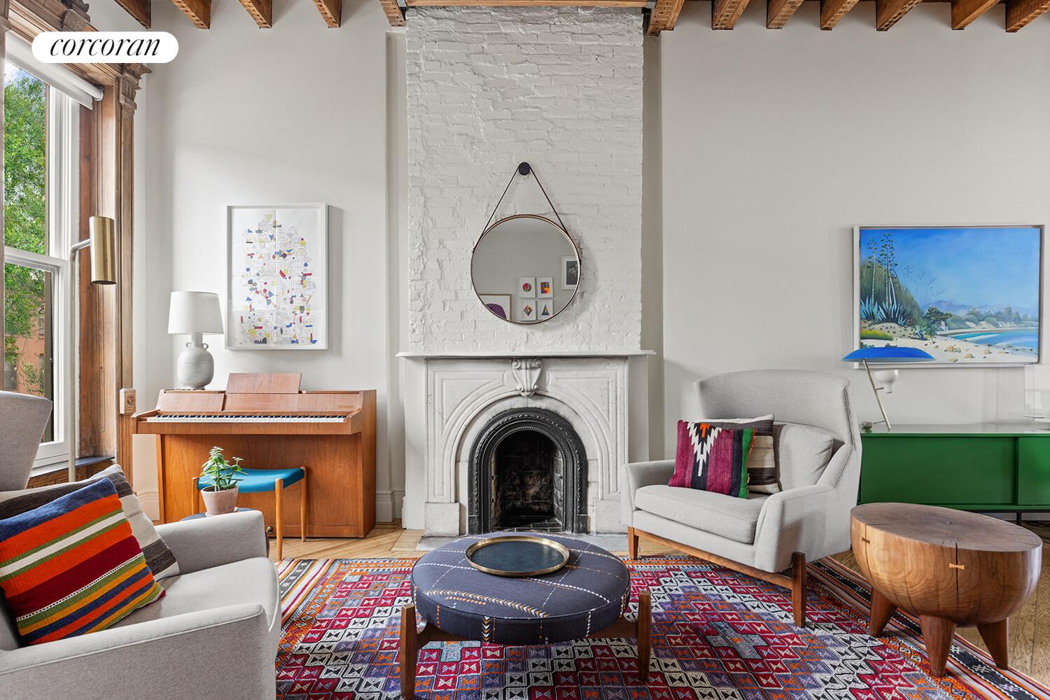 369 6th Street Brooklyn, NY 11215 - Photo 1 of 22 a living room with furniture a fireplace and a floor to ceiling window