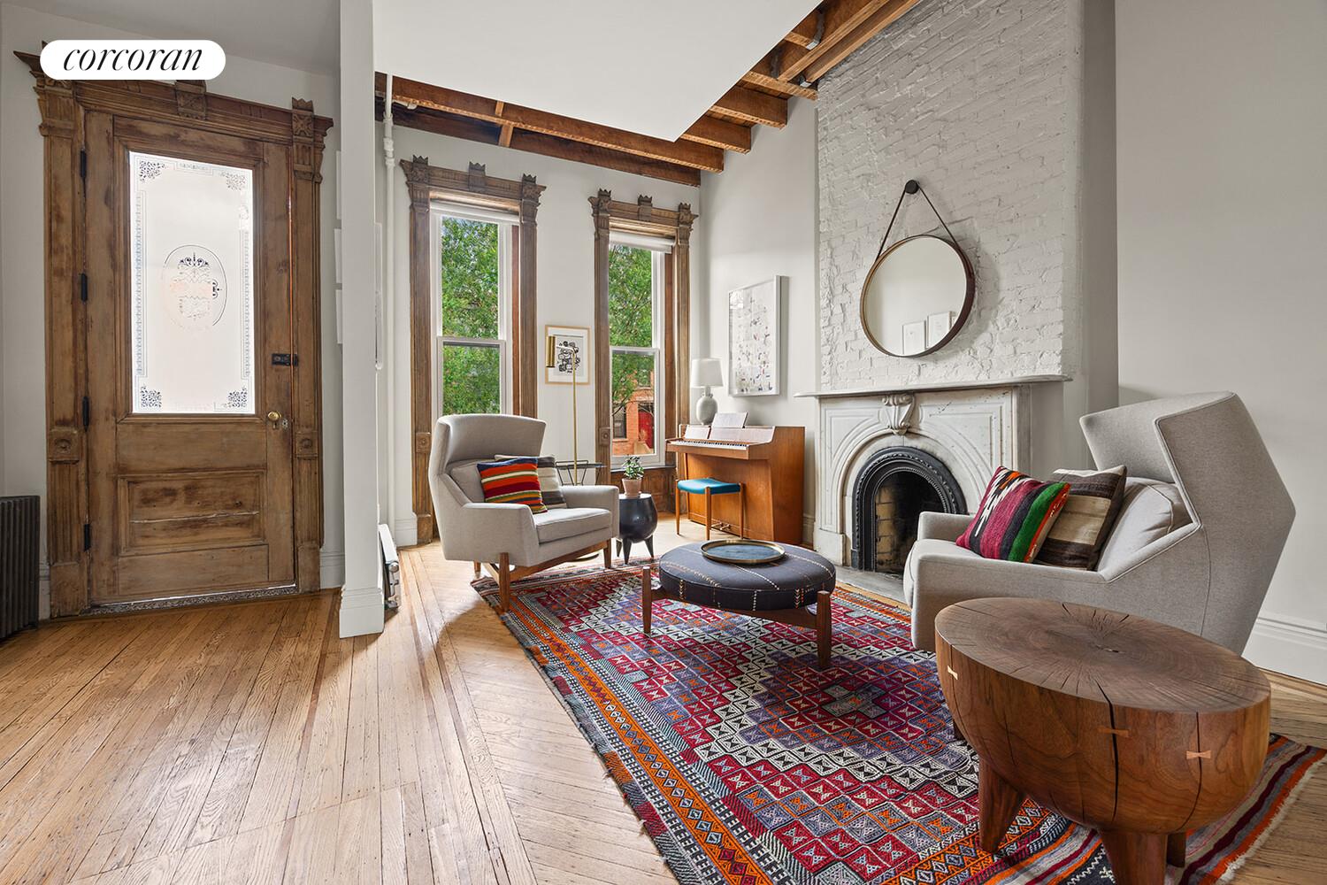 369 6th Street Brooklyn, NY 11215 - Photo 2 of 22 a living room with furniture a fireplace and wooden floor