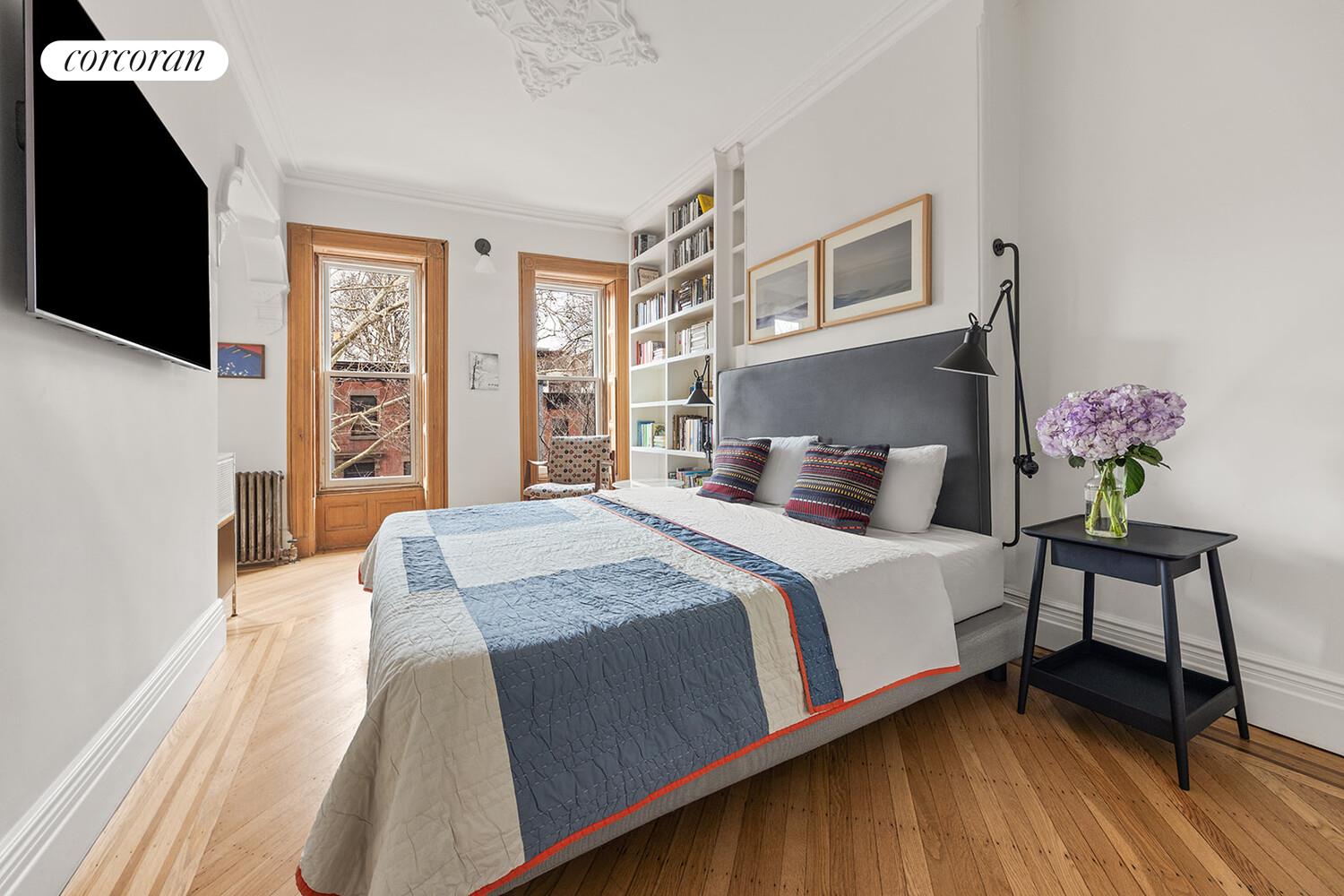 369 6th Street Brooklyn, NY 11215 - Photo 6 of 22 a bedroom with a bed and wooden floor
