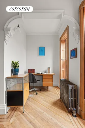 a bedroom with furniture and a fireplace