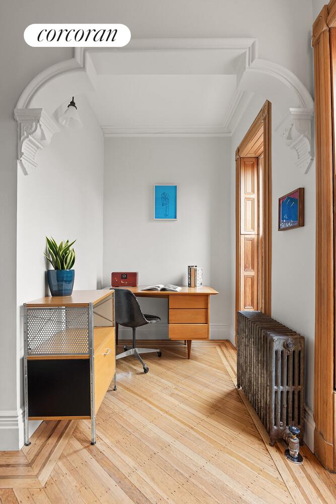 369 6th Street Brooklyn, NY 11215 - Photo 7 of 22 a bedroom with furniture and a fireplace