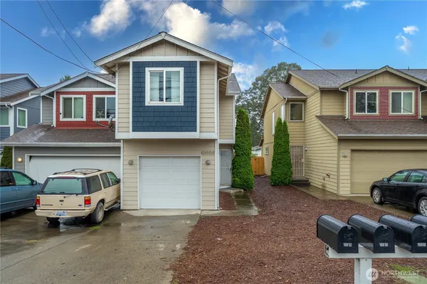 a front view of a house with parking