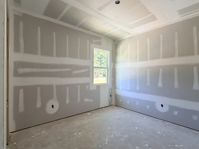 a view of staircase with white walls