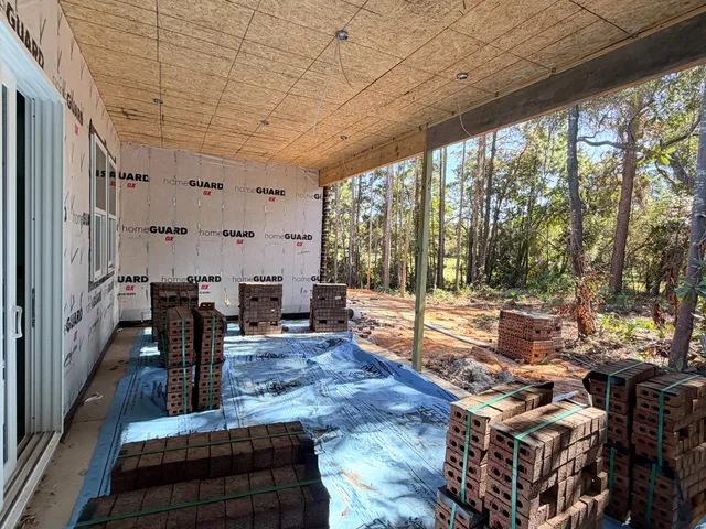a living room with lots of furniture and wooden floor