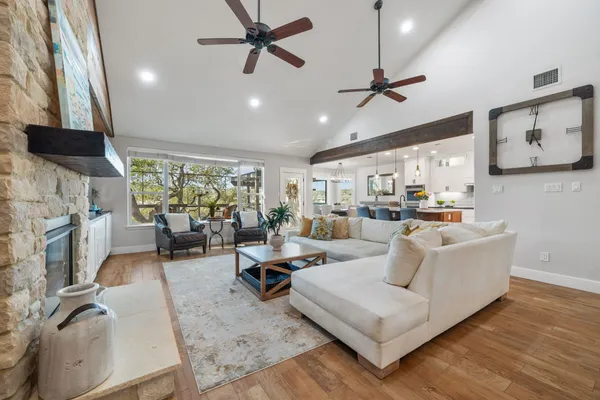a living room with furniture and a fireplace