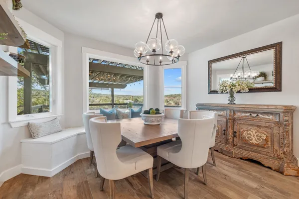 a view of a dining room with furniture window and outside view