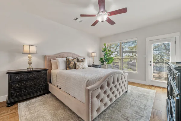 a bedroom with a bed and a tv