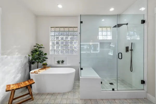 a bathroom with a bathtub and shower