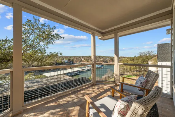 a view of a balcony with lake view and a ocean view