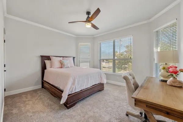 a bed room with a bed and a window