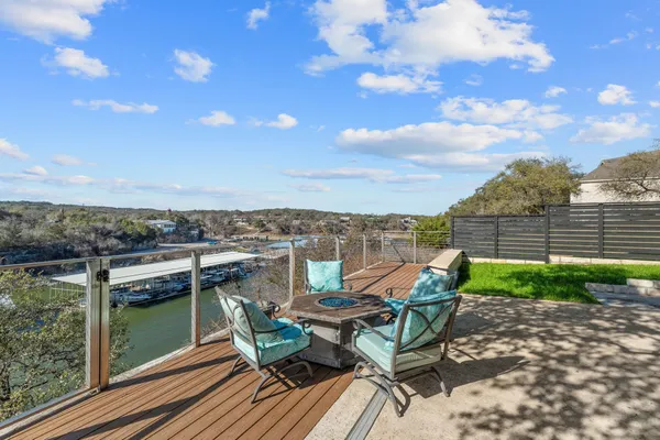 a view of a chairs and table in patio