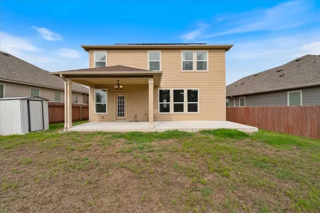 a view of a house with backyard