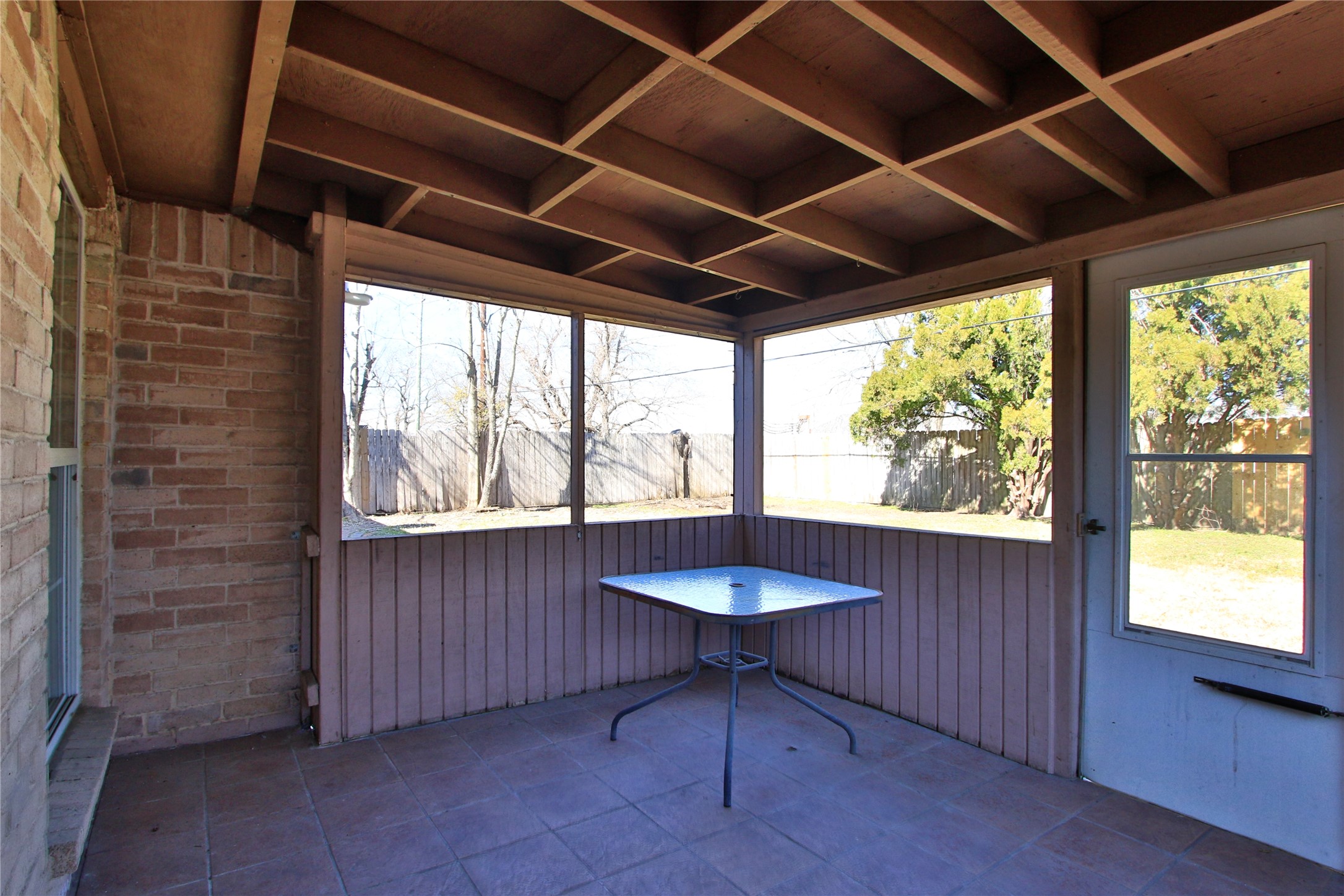 10922 Fallbrook Drive Houston, TX 77064 - Photo 21 of 28 Welcome to the backyard covered porch where you can escape the heat. There is a swing that can be used if desired,