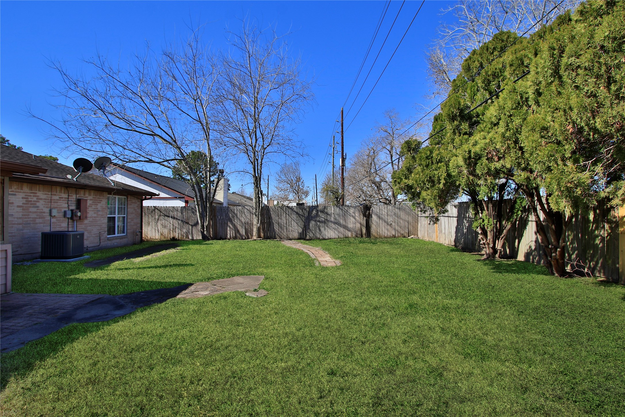 10922 Fallbrook Drive Houston, TX 77064 - Photo 23 of 28 This is a view from the right side of the backyard with plenty room for your toys or garden.