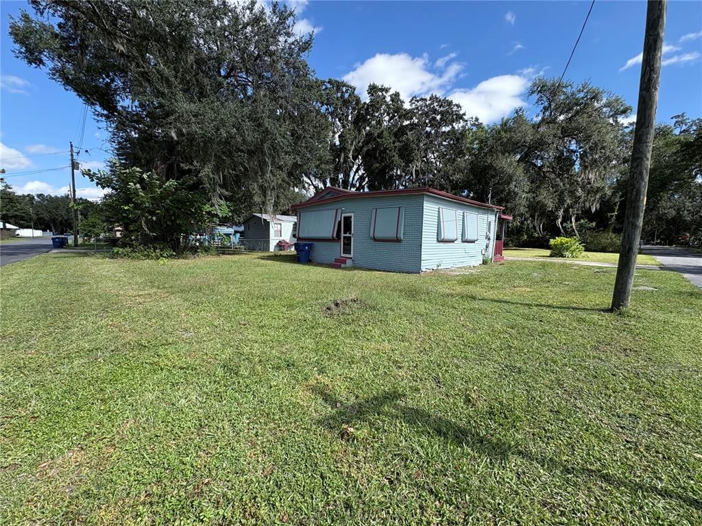 813 Northwest 5th Street Webster, FL 33597 - Photo 3 of 12 a house with a yard
