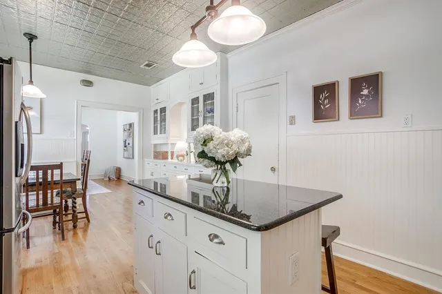 a kitchen with a table and chairs