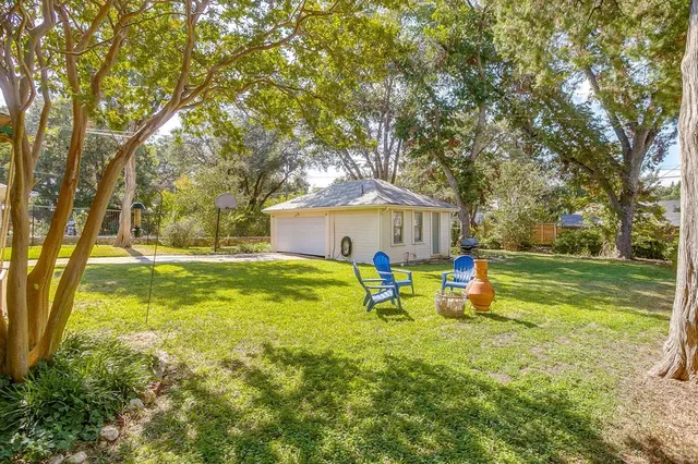 a front view of house with yard and seating area