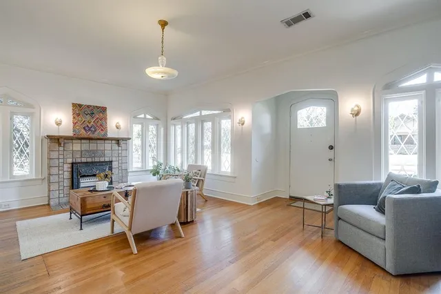a living room with furniture and a fireplace