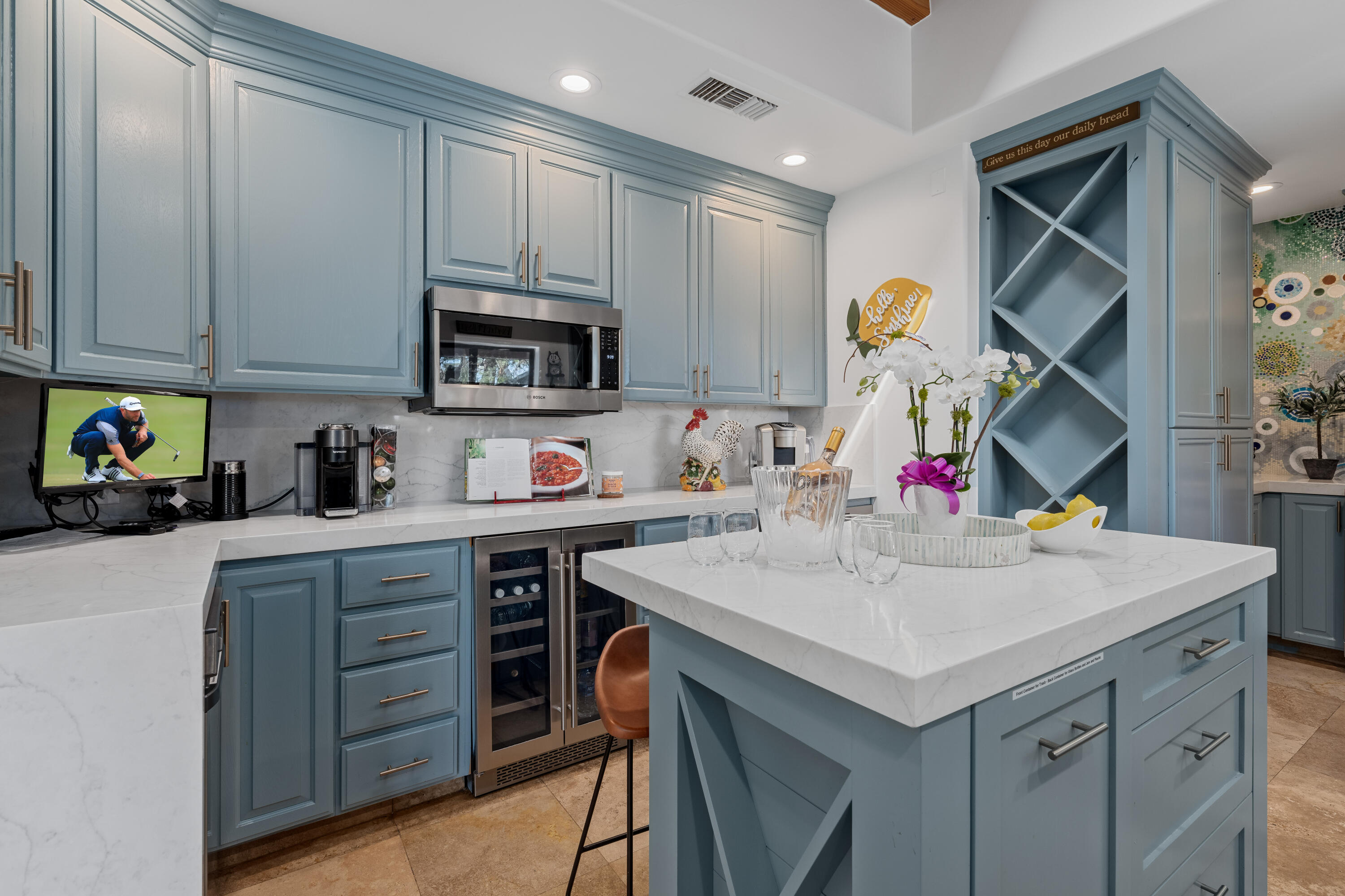 71510 San Gorgonio Road Rancho Mirage, CA 92270 - Photo 45 of 74 a kitchen with a sink a microwave and cabinets
