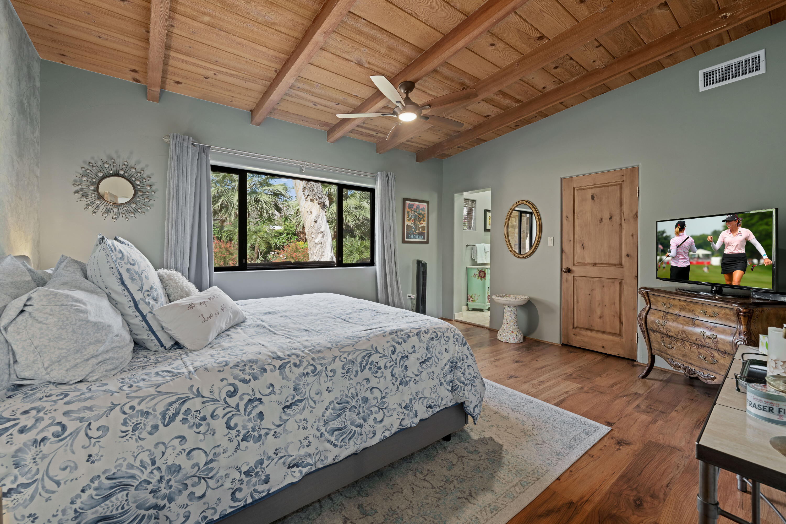 71510 San Gorgonio Road Rancho Mirage, CA 92270 - Photo 54 of 74 a bedroom with a bed and wooden floor