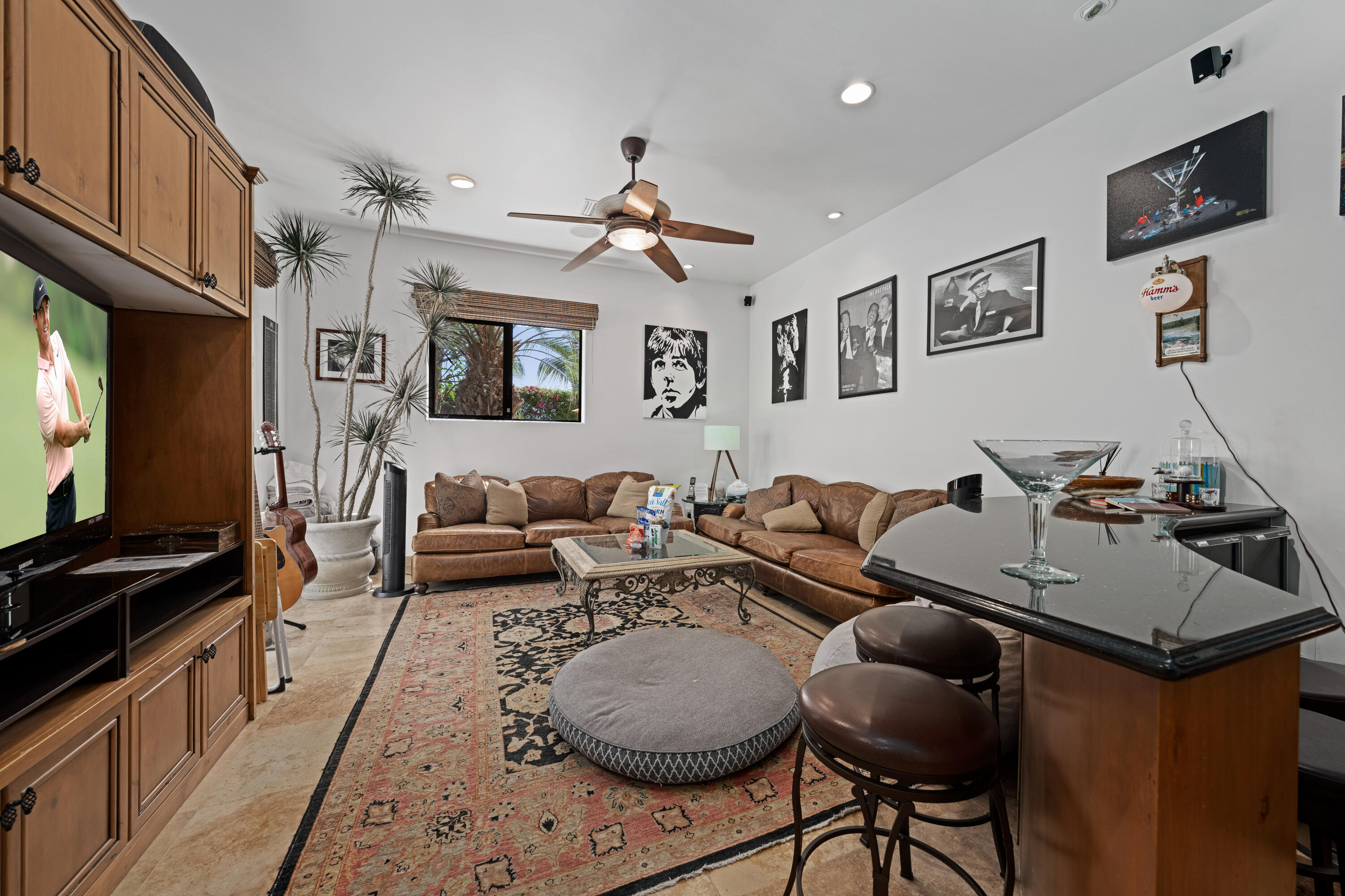 71510 San Gorgonio Road Rancho Mirage, CA 92270 - Photo 60 of 74 a living room with furniture a flat screen tv and kitchen view