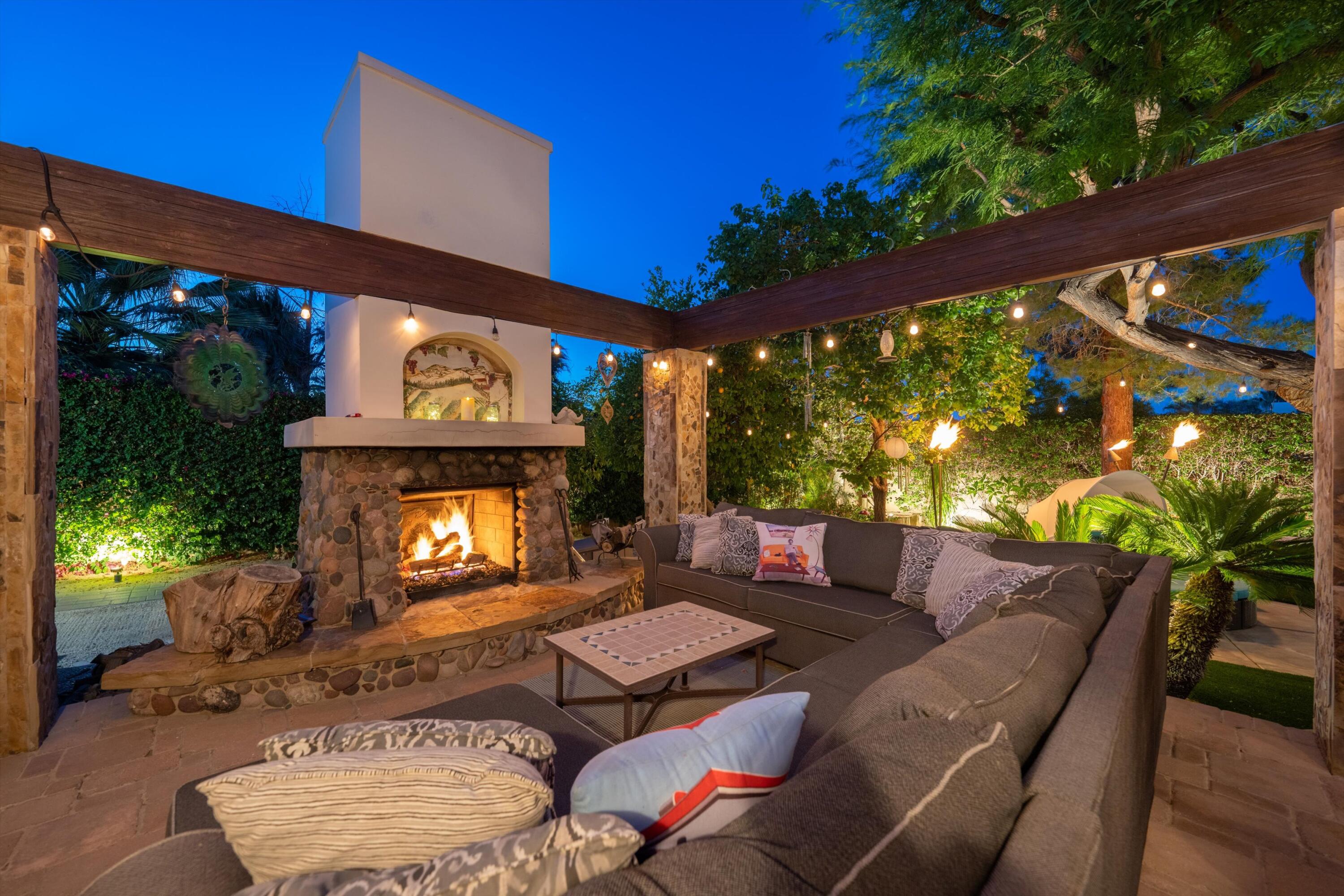 71510 San Gorgonio Road Rancho Mirage, CA 92270 - Photo 71 of 74 a outdoor living space with patio furniture and a fireplace