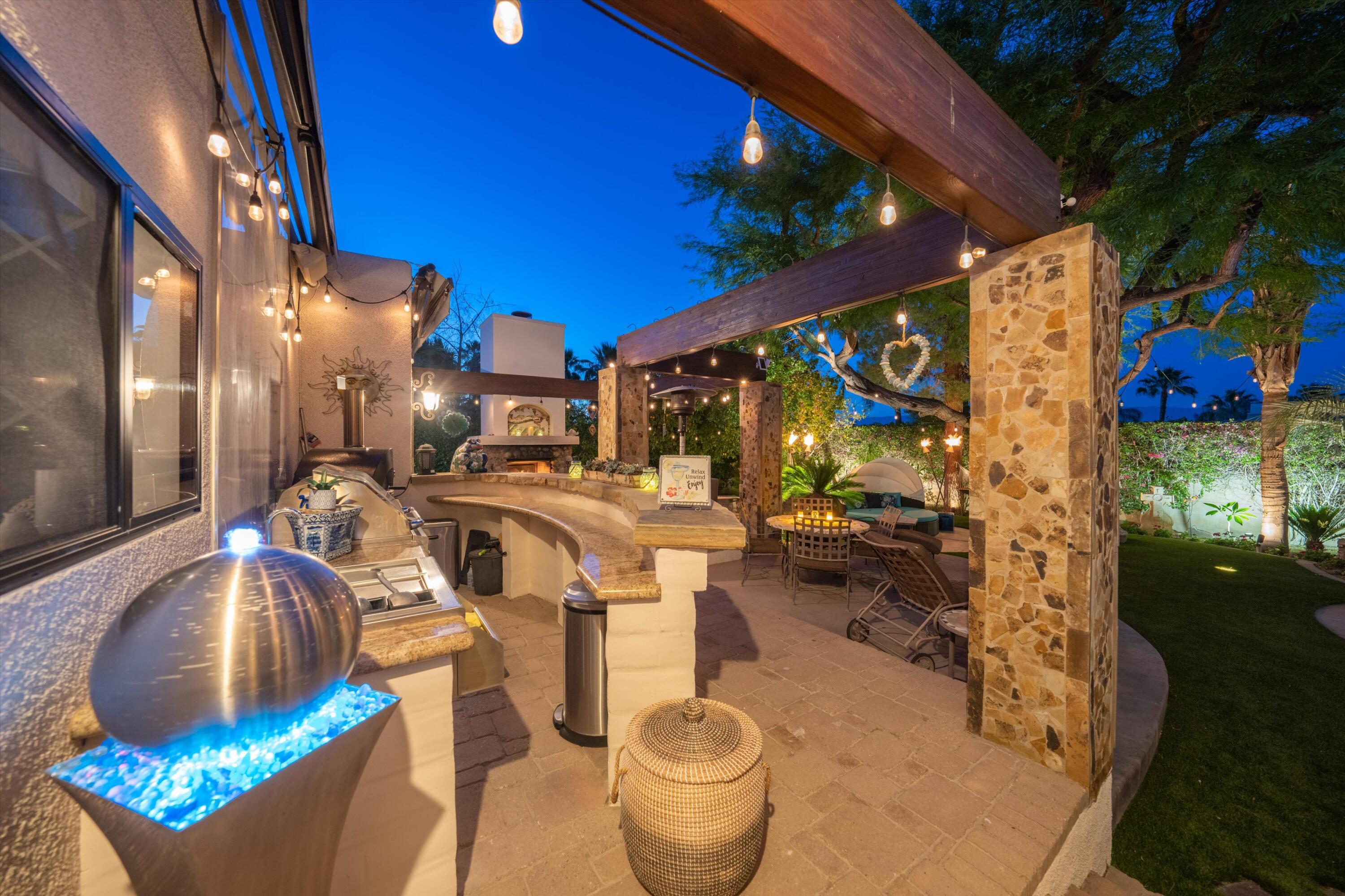 71510 San Gorgonio Road Rancho Mirage, CA 92270 - Photo 73 of 74 a living room with furniture and a floor to ceiling window