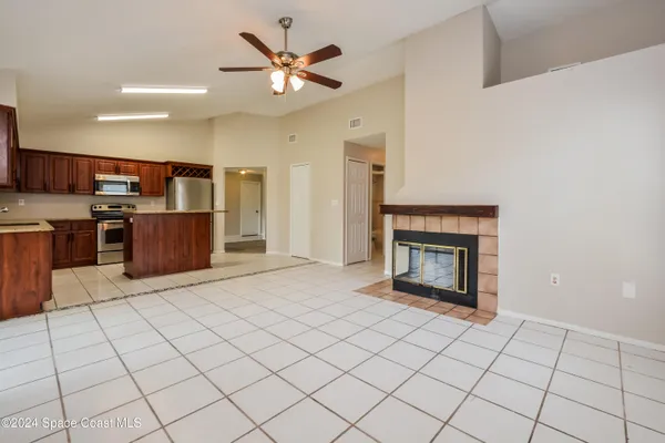 a kitchen with stainless steel appliances a stove top oven and a refrigerator