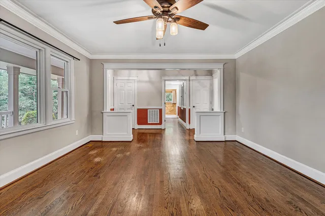 a large kitchen with stainless steel appliances a refrigerator and a stove top oven