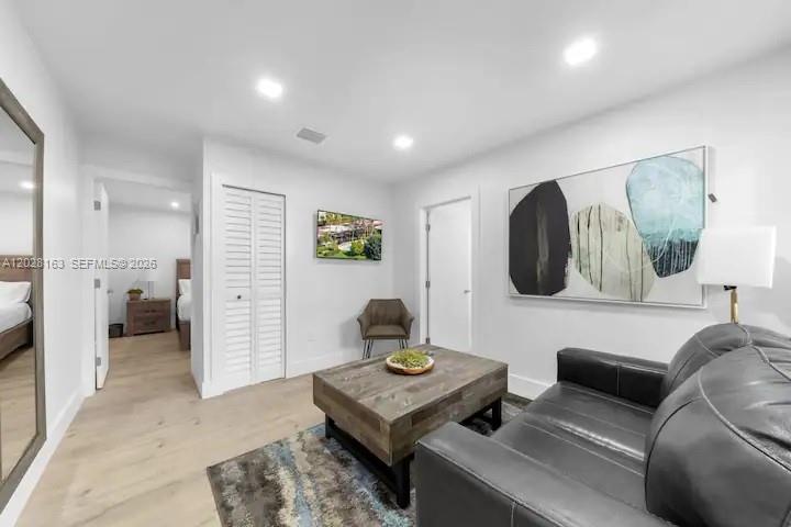 4290 Southwest 9th Street, Unit B Miami, FL 33134 - Photo 6 of 18 a living room with furniture and a table