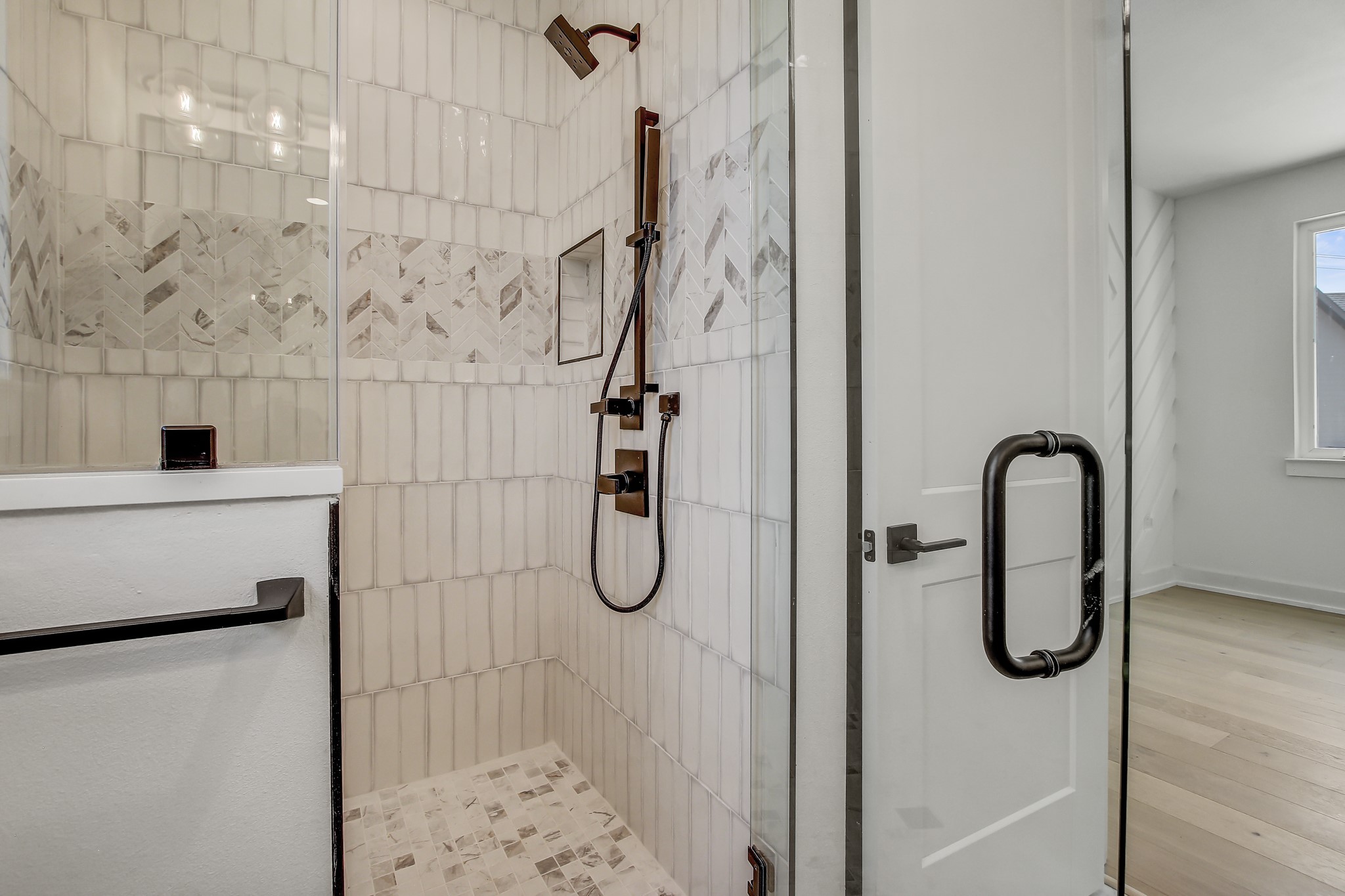 4127 East 12th Street, Unit 3 Austin, TX 78721 - Photo 18 of 29 Full bathroom with tiled shower and wood finished floors
