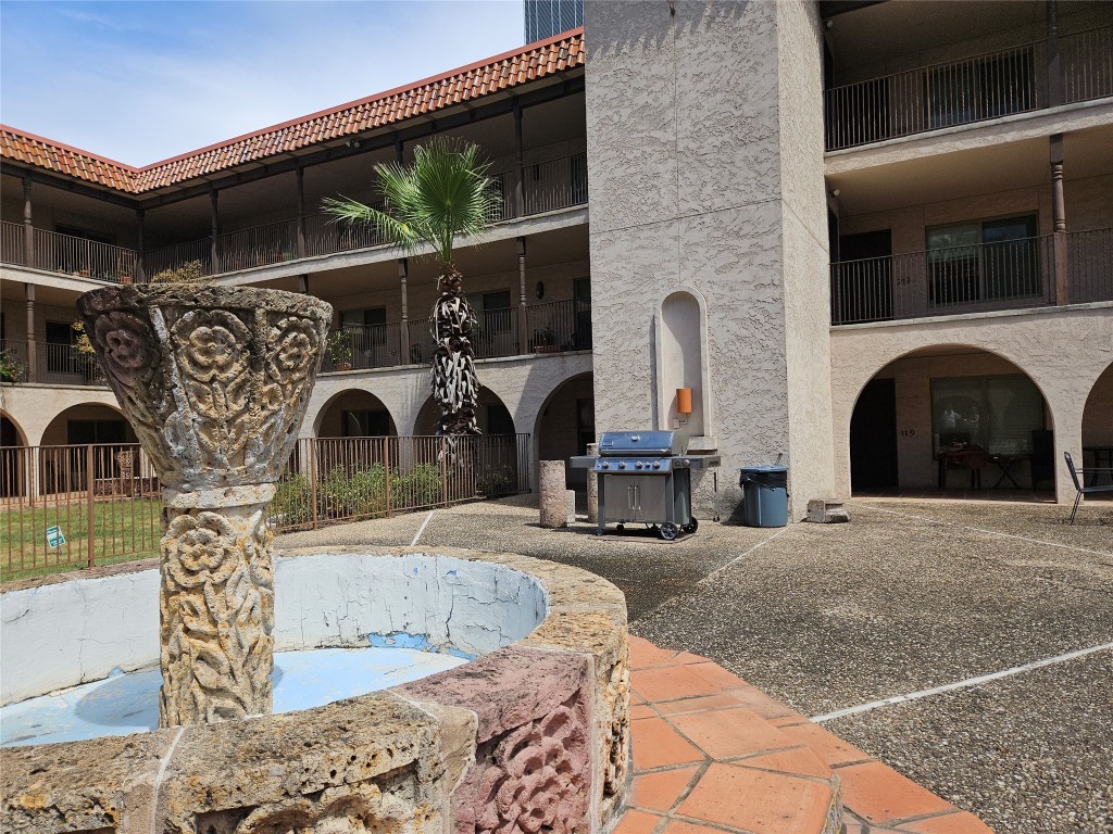 505 West 7th Street, Unit 108 Austin, TX 78701 - Photo 13 of 18 a view of living room with furniture and a fireplace
