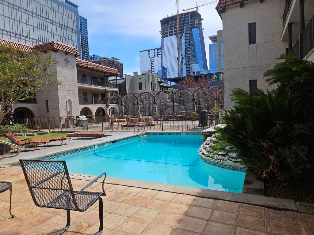 505 West 7th Street, Unit 108 Austin, TX 78701 - Photo 14 of 18 a house view with a sitting space fire pit and outdoor seating