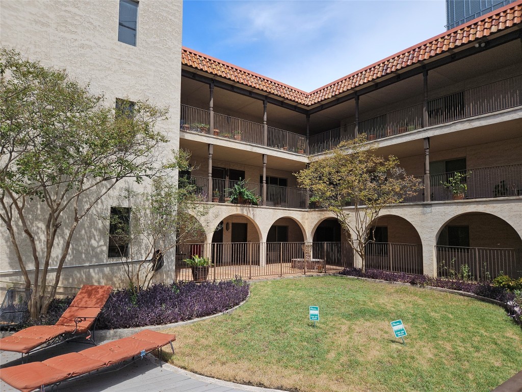 505 West 7th Street, Unit 108 Austin, TX 78701 - Photo 3 of 18 a view of building with door and outdoor space