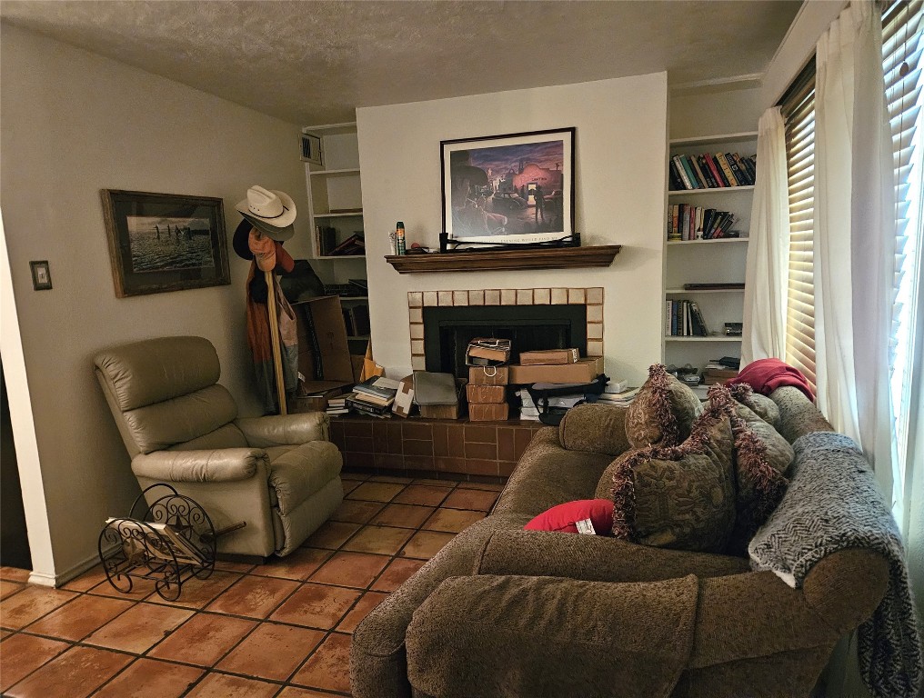 505 West 7th Street, Unit 108 Austin, TX 78701 - Photo 6 of 18 a living room with furniture and a fireplace