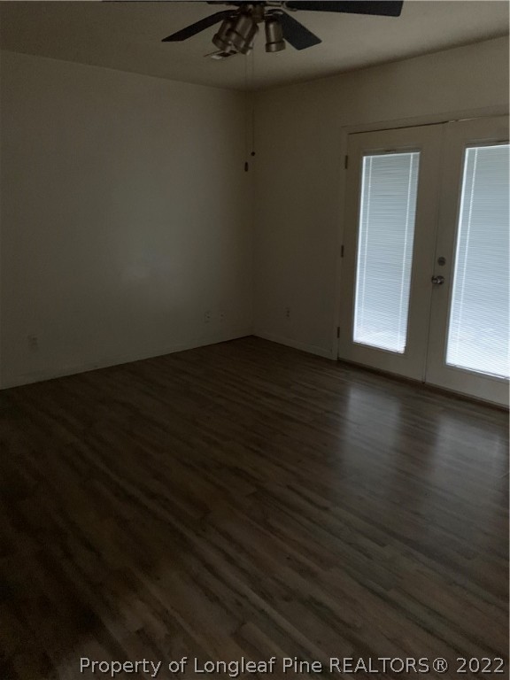 3309 Arrowhead Road Spring Lake, NC 28390 - Photo 3 of 10 a view of an empty room with wooden floor and a cabinet