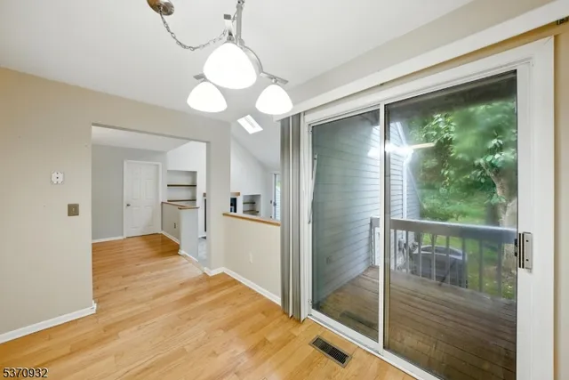 a view of a kitchen from the hallway