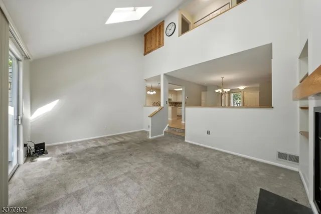 a view of a kitchen with furniture and a fireplace