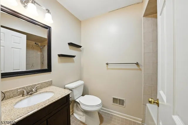 a bathroom with a shower and a sink