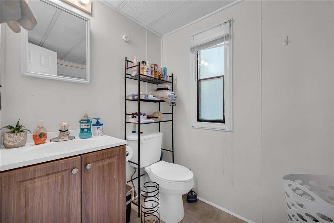 150 Newberry Road Walhalla, SC 29691 - Photo 18 of 47 A well-lit primary bathroom features a white vanity, a large mirror, and ample storage.