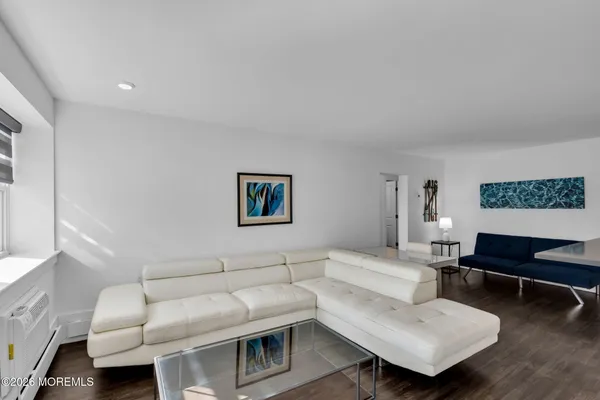 a living room with furniture and a piano