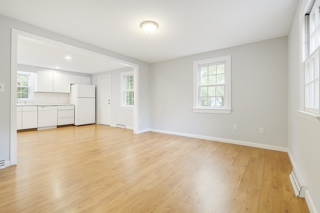 49 St Marks Road Falmouth, MA 02536 - Photo 12 of 38 a view of an empty room with wooden floor and a window