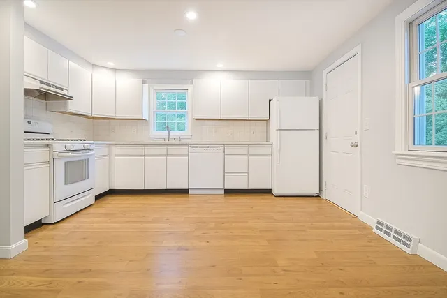 a view of a kitchen with a sink cabinets and a window