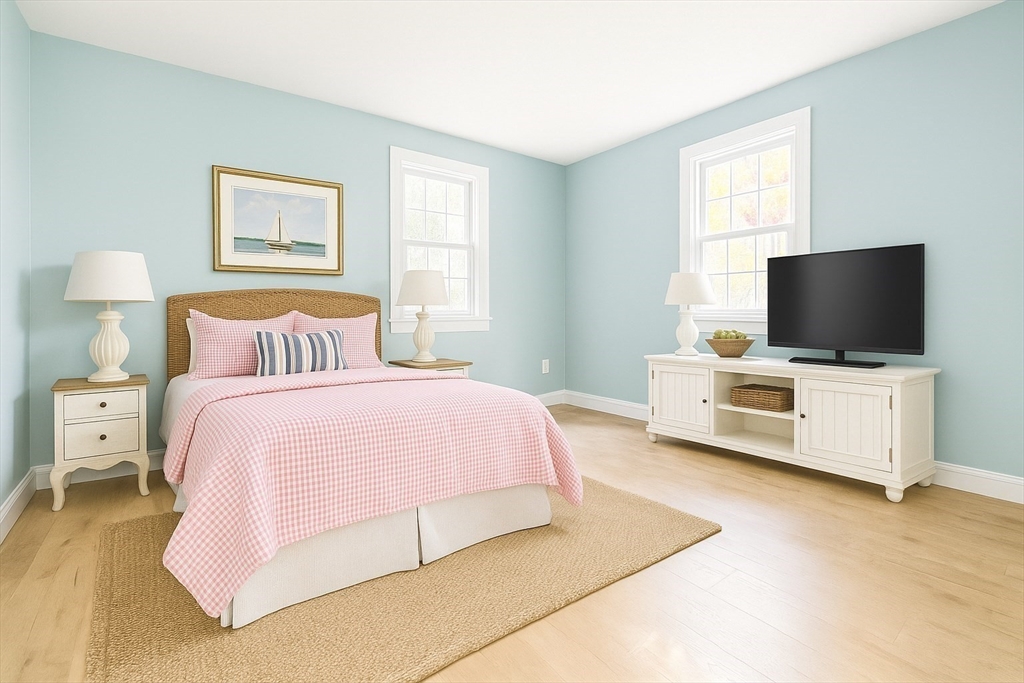 49 St Marks Road Falmouth, MA 02536 - Photo 24 of 38 a bedroom with a bed and flat tv screen on the dresser