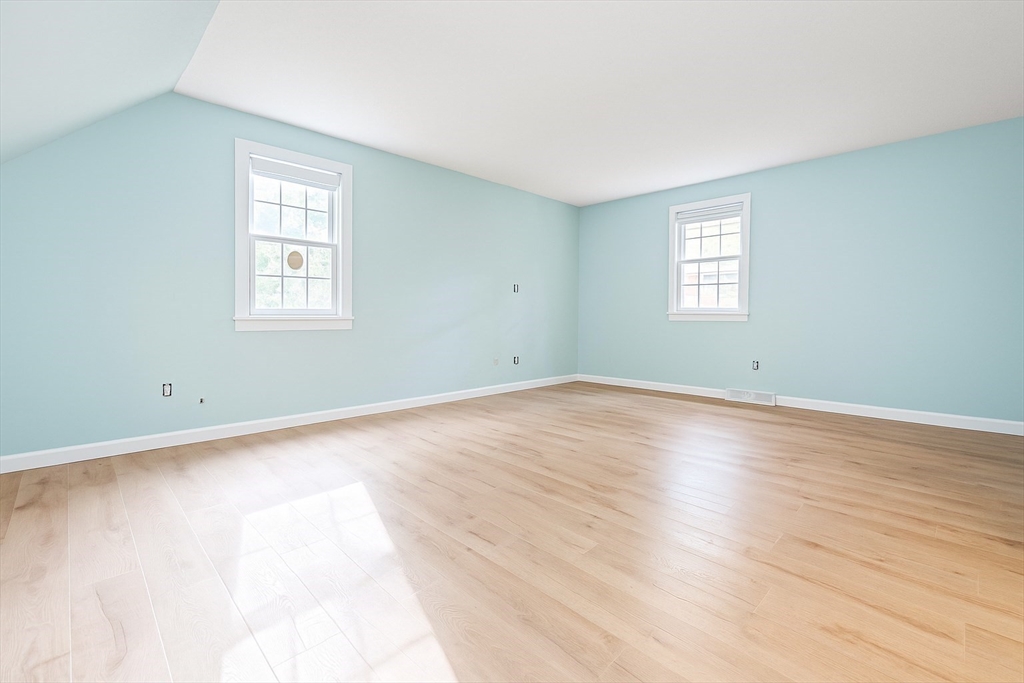 49 St Marks Road Falmouth, MA 02536 - Photo 29 of 38 an empty room with wooden floor and windows